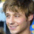 A pixelated image of a person with light brown hair and fair skin, alongside orange handwritten-style text reading "Oh So Sexy" on a white background.