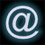 Four @ symbols arranged in a , each with a glowing neon effect on a dark background, showing subtle variations in brightness and color across the