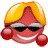 Animated cartoon character with red face, blonde hair, black sunglasses, and red circular earrings smiling with visible teeth.