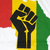 Black silhouette of a raised fist with yellow accents on a background divided into red, yellow, and green vertical stripes.