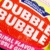 Red 'DUBBLE BUBBLE' logo with yellow and blue accents, featuring a sequence of four white pixelated symbols changing from dots to hearts.
