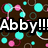 Pixelated graphic with bold white text "Abby!!!" on black background, surrounded by cyan and pink circular shapes on brown backdrop.