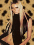 A woman with long blonde hair wears a black sleeveless top against a leopard-print background, her pose and expression shifting slightly across frames.