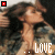 A person with long brown hair in a denim jacket, hands clasped near the neck, with the word 'LOVE' displayed in white text below.