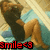 Pixelated image of a person lying on a bed with light blue sheets, wearing dark top and light pants, with red text overlays.