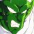 Green pixelated figure with white accents on a light background, showing partial facial features and body shape.