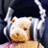 Pixelated cartoon character with light brown fur and white hair, wearing headphones against a dark background.