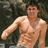 Pixelated image of a shirtless person with visible abdominal muscles against a dark background, overlaid with cyan text on a blue field.