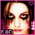 Pixelated image of a person with brown hair and dark eye makeup, featuring a pink heart symbol in the top right corner and 'fan' text at the bottom left.