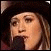 Two side-by-side pixelated images of a person with light brown hair wearing dark clothing, showing sequential facial expressions from neutral to crying.