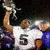 Animated sequence of a football player in white jersey with number 5 holding a trophy, transitioning from raised arm to lowered position.
