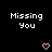 Pixelated text 'Missing You' in white on black background with two pink heart symbols below.
