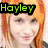 A pixelated image of a person with orange hair and green text reading 'Hayley' above, transitioning to red text reading 'Fucking' below.