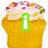 Animated cupcake icon with yellow cake base, pink frosting topped with colorful sprinkles, and a green information symbol on the left side.