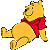 Pixelated yellow cartoon bear wearing red shirt lying on gray background with one arm raised and leg bent, static single-frame image.