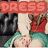 A pixelated image of a character in traditional attire with red and green clothing, under a banner reading "DRESS" in two styles.