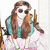 Pixelated static image of a person with long brown hair wearing sunglasses and a teal jacket over white clothing, holding an object near their face.
