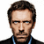 Pixelated static image of a person with short dark hair, light skin tone, blue eyes, and a neutral expression wearing a black top with a blue lanyard.