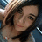 A pixelated image of a person with dark hair and a light-colored top, with blue text reading "Love" and "Katie :D" below.