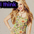 A pixelated image of a woman in a floral dress with long hair, showing text overlays that change across frames.