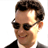 Static 48x48 pixel icon of a person with dark hair, sunglasses, and a black jacket over a white shirt against a plain background.