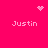 Pixelated pink background with four 'Justin' text instances and three distinct pixel art symbols: a heart, starburst, and dot cluster.