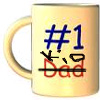 A light yellow ceramic mug with a handle on the left side, featuring blue '#1' text above red 'Dad' text crossed out with a black line.