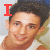 A pixelated image of a person with dark hair wearing a white sleeveless shirt, featuring red text and symbols in four variations.