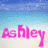 Pixelated beach scene with blue sky and ocean gradient background, pink text 'Ashley' in foreground.