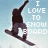Pixelated image of a person snowboarding with arms raised, text "I LOVE TO SNOW BOARD" in block letters on light blue background.