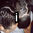 A pixelated image of two people with dark hair in a close embrace, one person's back visible to the viewer.