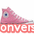 Pixelated pink high-top shoe with blue eye-like detail and partial red text overlays on white background.