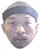 Two side-by-side pixelated headshots of a person wearing a dark cap, one with neutral expression and the other smiling.