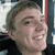 A static image with four quadrants: top-left shows a person's face, top-right displays text on dark background, bottom-left has date and phrase text, bottom-right is empty gray.
