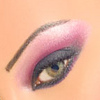 A close-up of a human eye with pink eyeshadow, dark eyeliner, and a visible eyebrow on a light skin tone background.