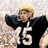 Pixelated image of a person in a black and white sports jersey with number 15, standing against a light background.