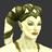 Pixelated image of a person with light skin, closed eyes, and dark hair styled in an updo with white accents against a solid gray background.