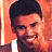 Static 48x48 pixel icon showing a close-up of a person with short dark hair against an orange background, wearing a white shirt and dark jacket.