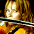 A pixelated image shows a person with light brown hair holding a violin bow, next to bold black text on yellow background reading "The Bride Kill Bill".