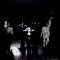 A black-and-white animated sequence showing a woman in a dark top performing a series of expressive hand gestures and head movements against a solid black background.