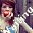 Pixelated static image of a person with dark hair wearing light-colored clothing, holding an object near their mouth against a blurred background.