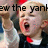Pixelated image of a person with light hair wearing a dark suit, white shirt, and red tie, mouth open in a shout, with overlaid black text reading 'ew the yank' across the face.