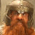 A pixelated buddy icon featuring a bearded character with long hair and a helmet on the left, next to brown blocky text reading "NO ONE TOSSES A DWARF" on the right.