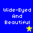 Blue background with white pixelated text "Wide-Eyed And Beautiful" and two star icons, one yellow and one gray.
