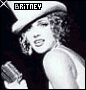Britney Spears in a white hat holding a microphone, with 'BRITNEY' text above her head and sparkles appearing across the image.