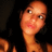 A pixelated image of a person with long dark hair, light skin tone, and pink lips in three distinct poses against a dark background.