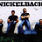 Static pixel art of four figures in dark shirts and blue pants standing against a light background with partial text at the top.