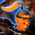 Pixelated abstract composition with orange, blue, and dark brown tones forming curved shapes against a multicolored background.