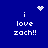 Blue background with white pixelated text 'i love zach!!' and animated heart or starburst symbols above the text.