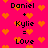 Pixelated text on a bright pink background with orange hearts, showing 'Daniel + Kylie = Love' repeated twice.